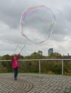 child making a giant bubble