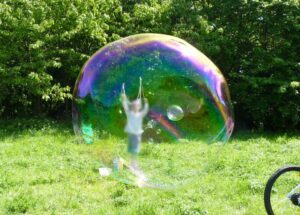 child making a giant bubble