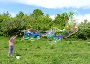 making giant bubbles on a windy day