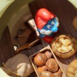 Papa smurf inspecting grain and hezelnuts stored inside a granary