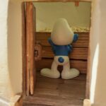 smurf looking at grain inside a granary