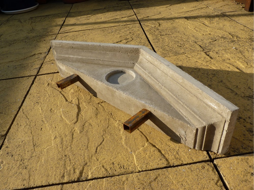 freshly cast concrete pediment