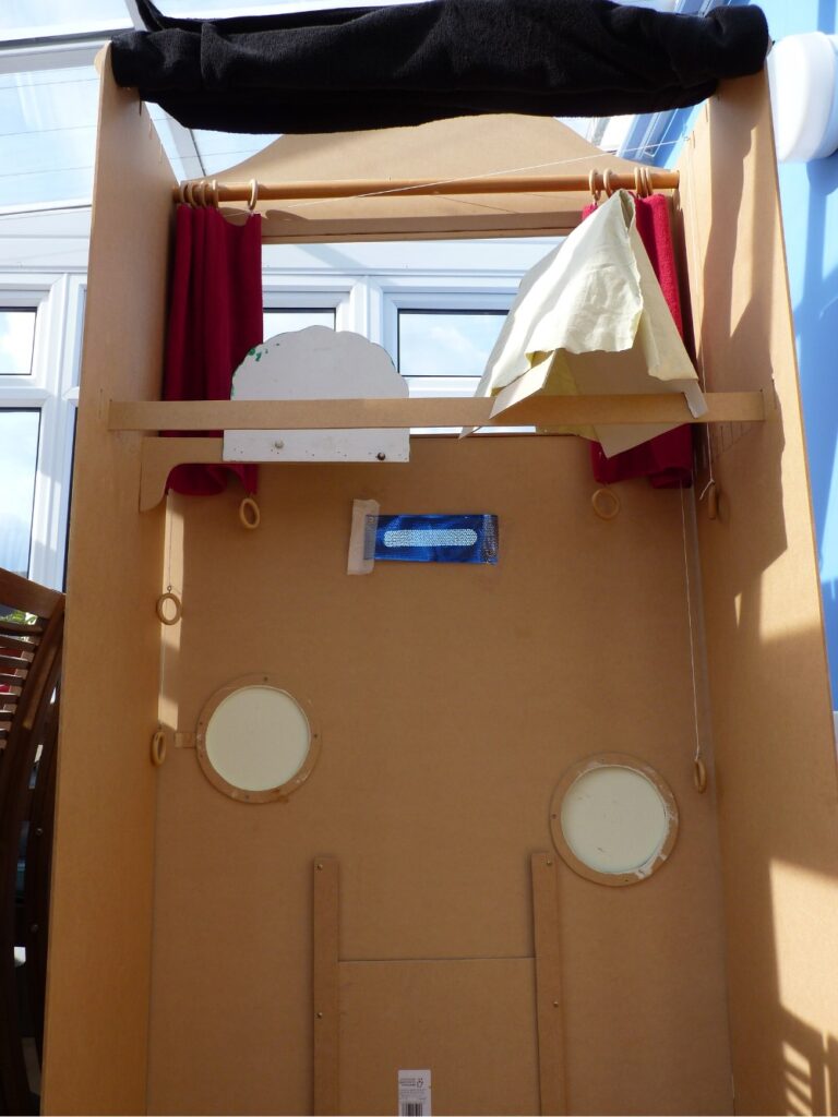 the inside of a home-made puppet theatre